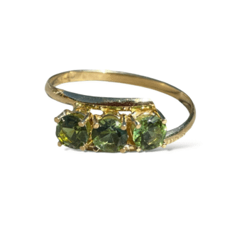 Bague trilogie de péridots en or 18 carats d’occasion