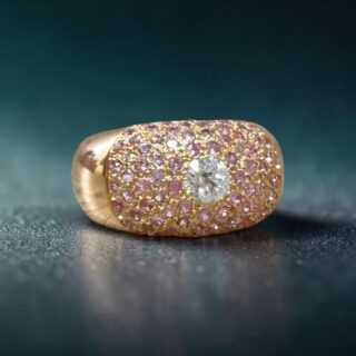 Bague dôme or rose 18 carats diamant 0.50 ct pavage saphirs roses