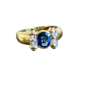 Bague rouleau saphirs et diamants en or 18 carats