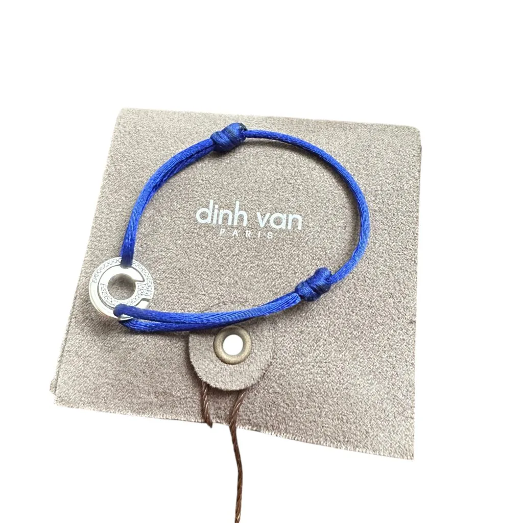 Bracelet Dinh Van Seventies en or 18 carats et diamants sur cordon bleu